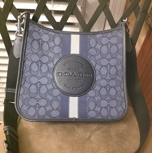 Coach Navy and White Signature Stripe Crossbody Bag. 10 1/2L,10 H , 2 3/4 W..